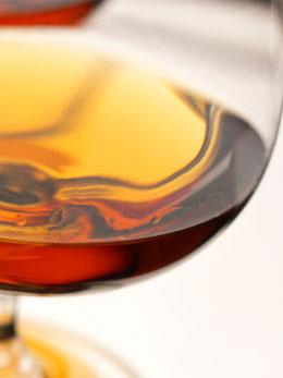 Detail of a brandy sniffer with some brandy.