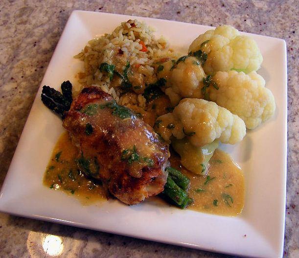 Meat, rice and coliflower on a plate