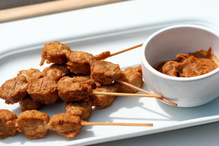 Chicken satays with peanut sauce.