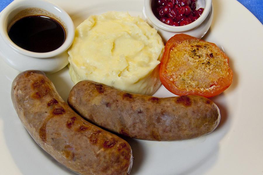 Deer sausages with potato mash and sauces.