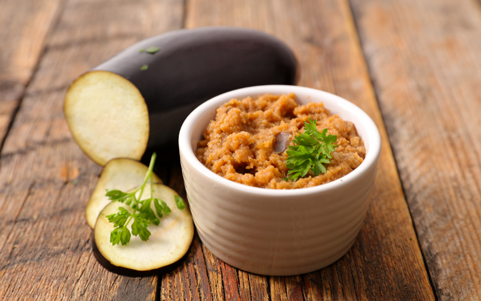 A small bowl with eggplant paste.