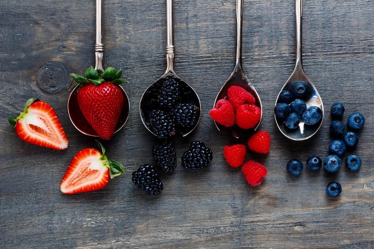 A selection of edible berries including strawberries. blackberries, raspberries and blueberries.