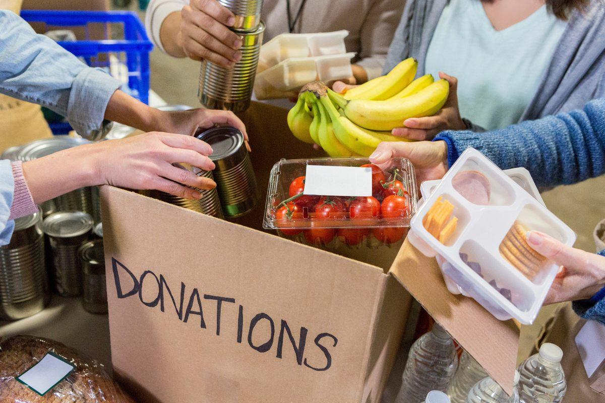 Volunteers unpacking donated food.