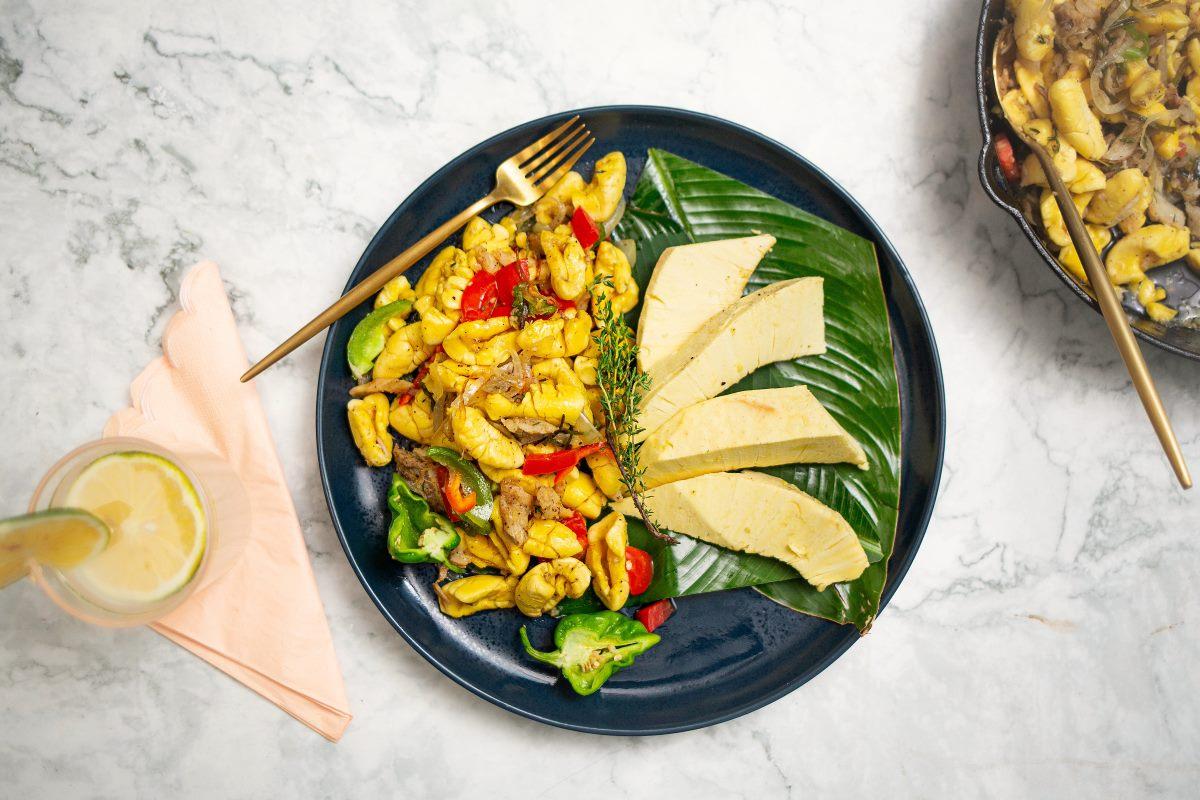 Ackee and saltfish with breadfruit ina a plate.