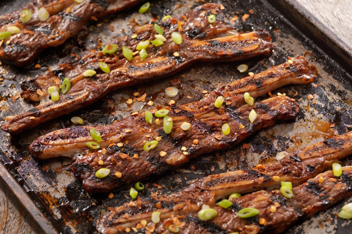 A few beef short ribs, cut and marinated Korean style, already cooked.