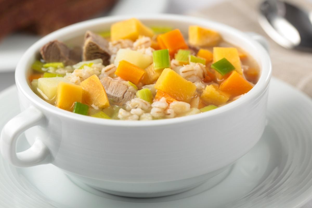 A cup of Scotch broth with lamb, potato, carrot and barley. 
