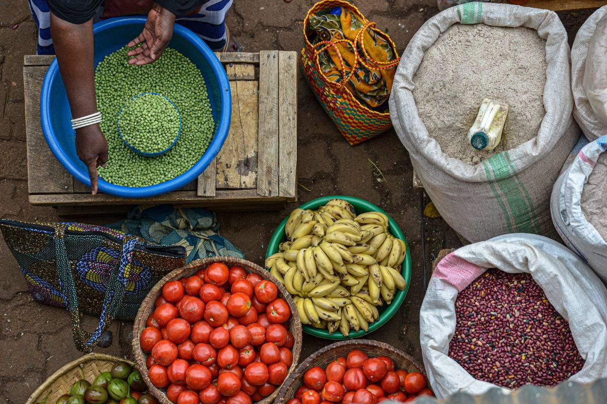 Woman selling food in Huye market, Rwanda.