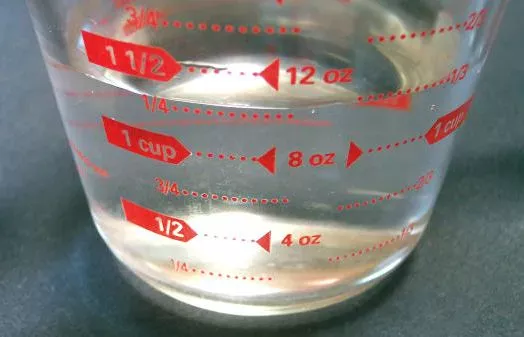 Measuring jug, measuring pitcher.