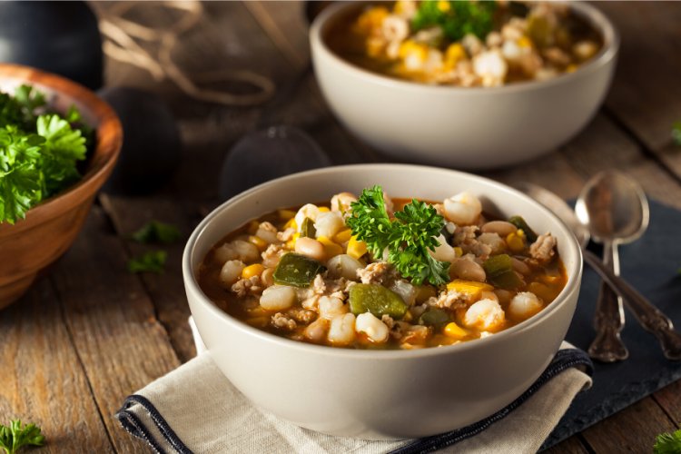 A bowl with chicken chili.