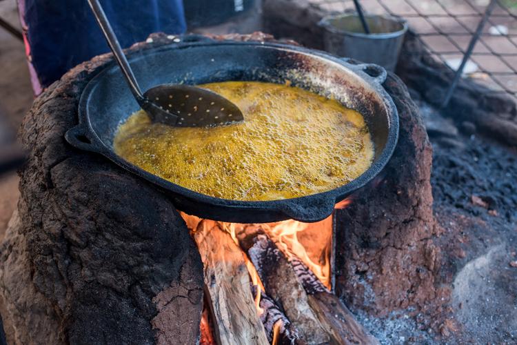 Bean cakes being fried in palm oil at Ekiti, Nigeria.