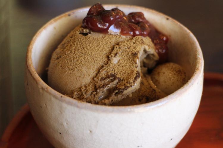 One scoop of hōjicha ice cream in a ceramic bowl.