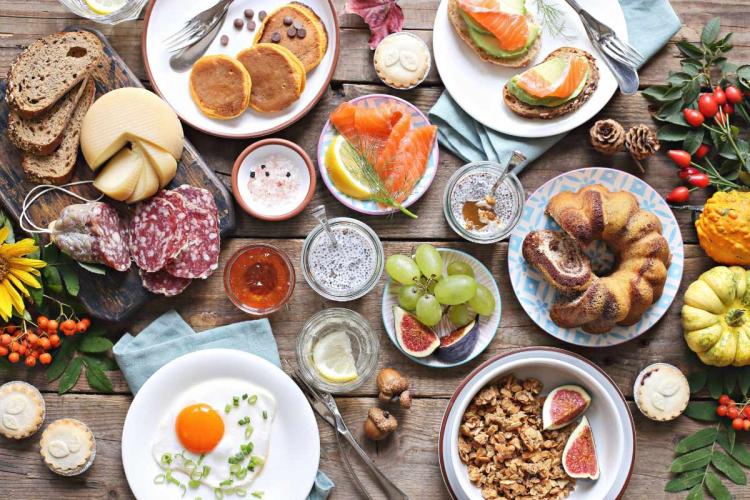 Overhead view of a plentiful brunch set on a rustic table.