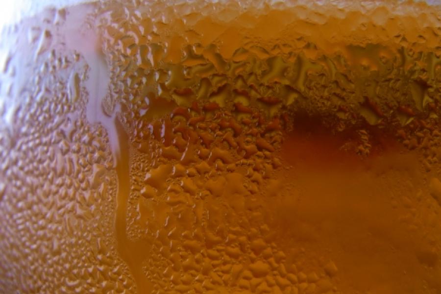 Close up of a glass of chilled beer.
