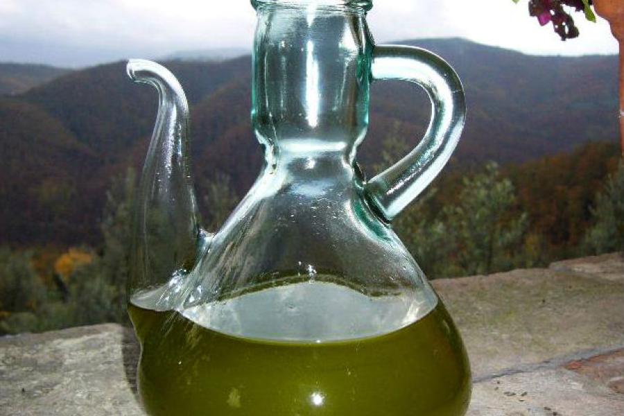 A jar with virgin olive oil.