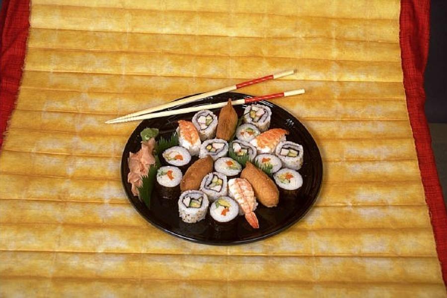 A plate with nori sushi.