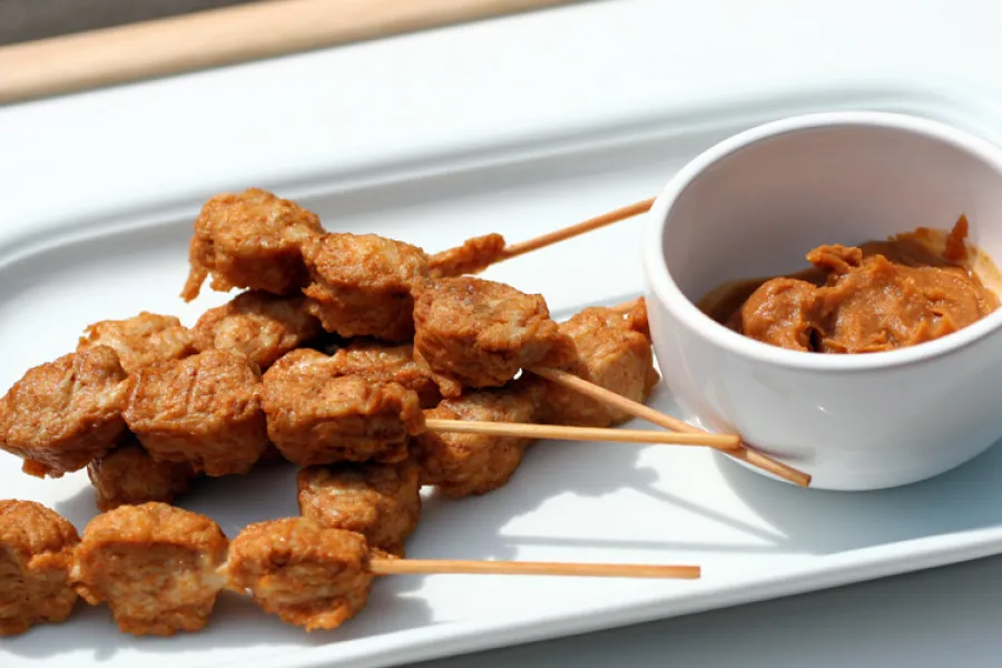 Chicken satays with peanut sauce.