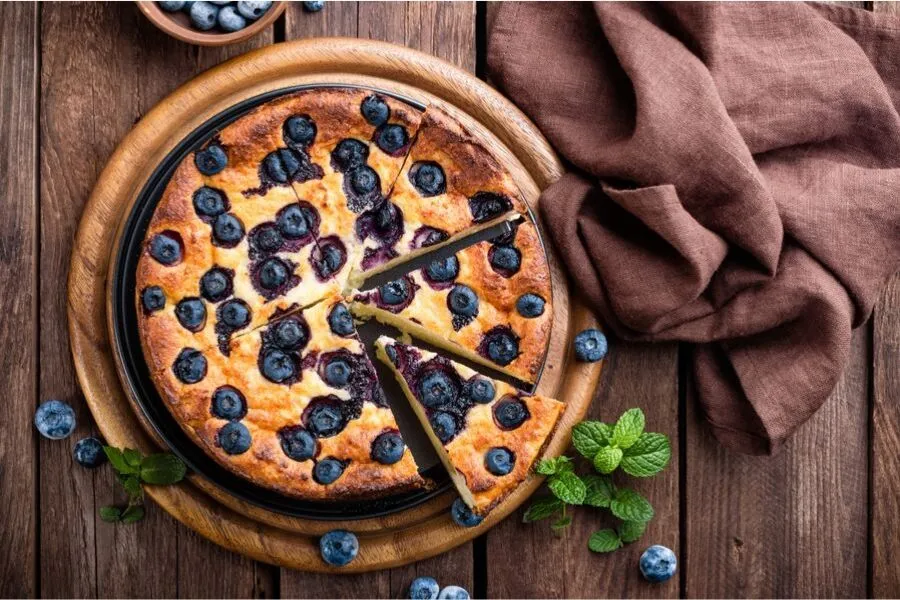 Blueberry cake on a serving plate.