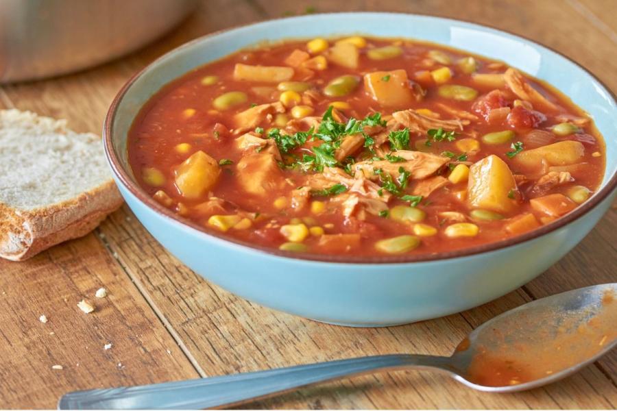 A deep palte with Brunswick stew.