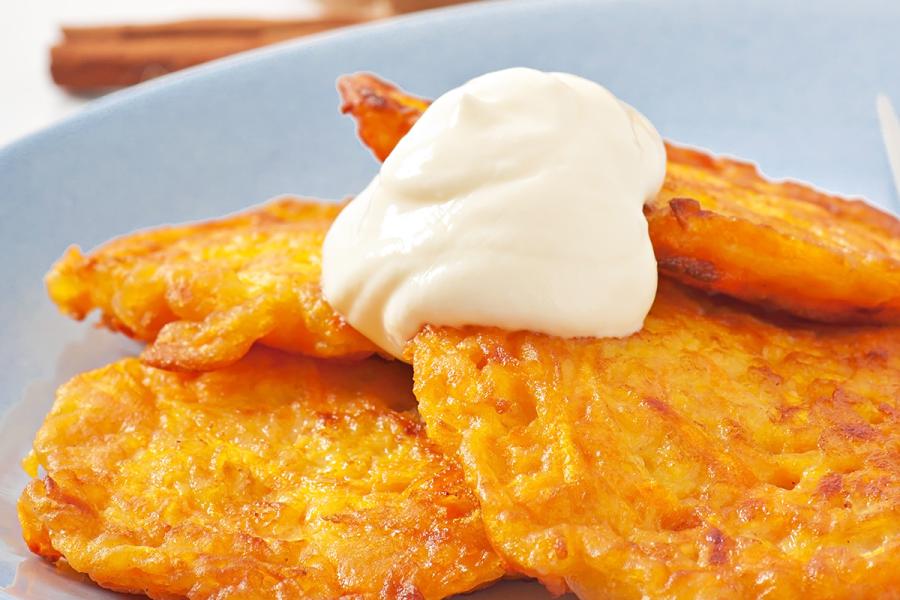 Pumpkin fritters with cream and cinnamon sugar.
