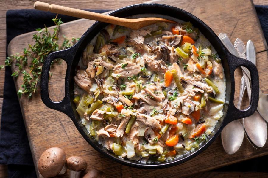 Wild rice and chicken soup in a Dutch oven.