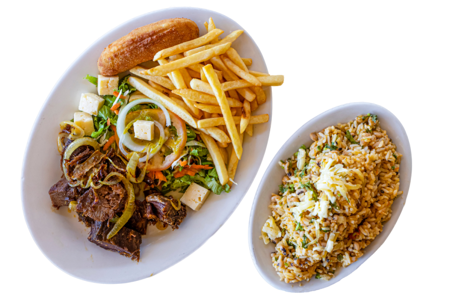 A Brazilian meal with meat, salad, French fries and fried banana.
