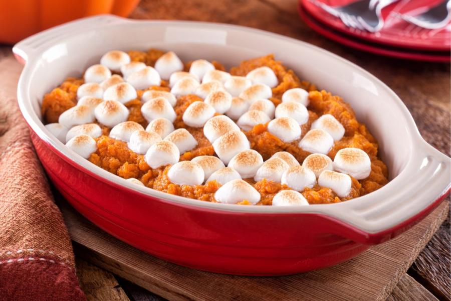 A dish of sweet potato casserole with marshmallow topping