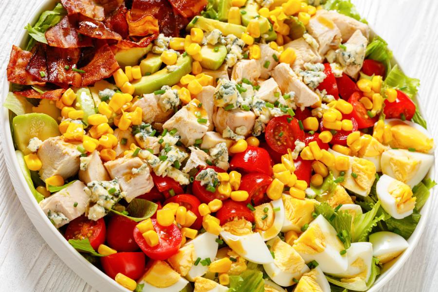 A Cobb salad, or American garden salad, in a serving plate.