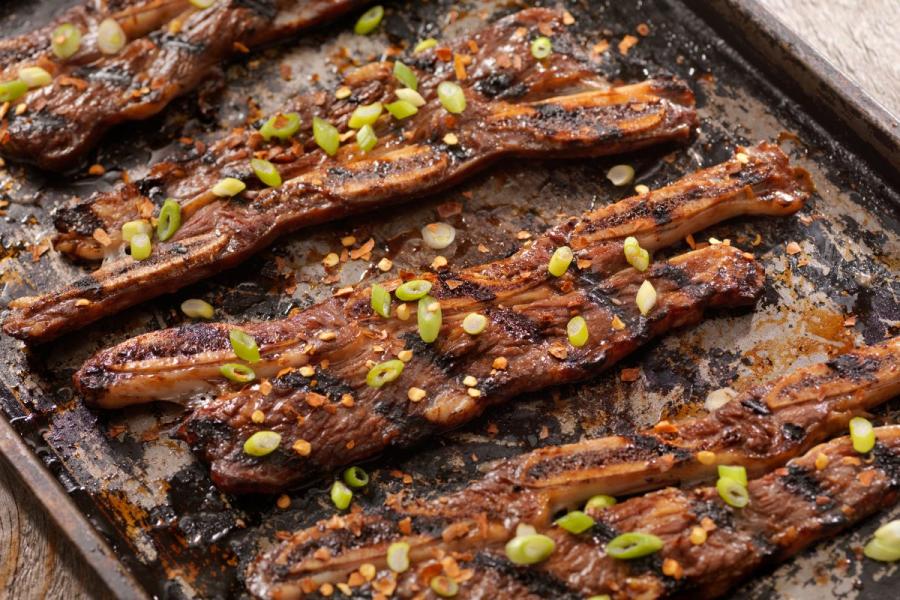 A few beef short ribs, cut and marinated Korean style, already cooked.