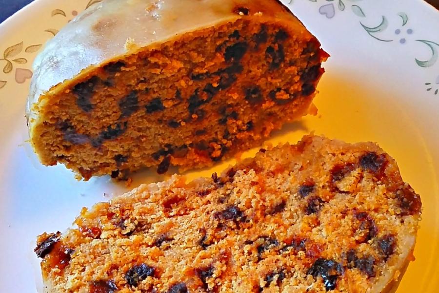 Clootie dumpling, a traditional Scottish suet and fruit dumpling, sliced open.