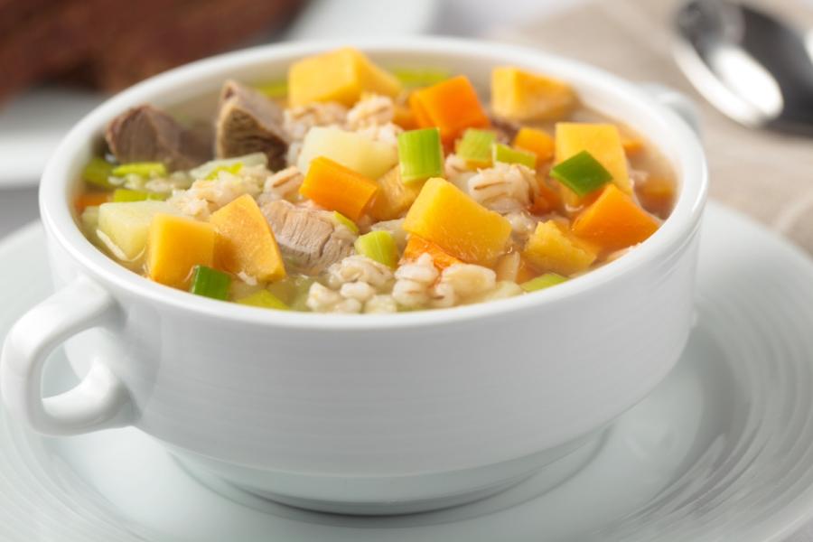 A cup of Scotch broth with lamb, potato, carrot and barley. 