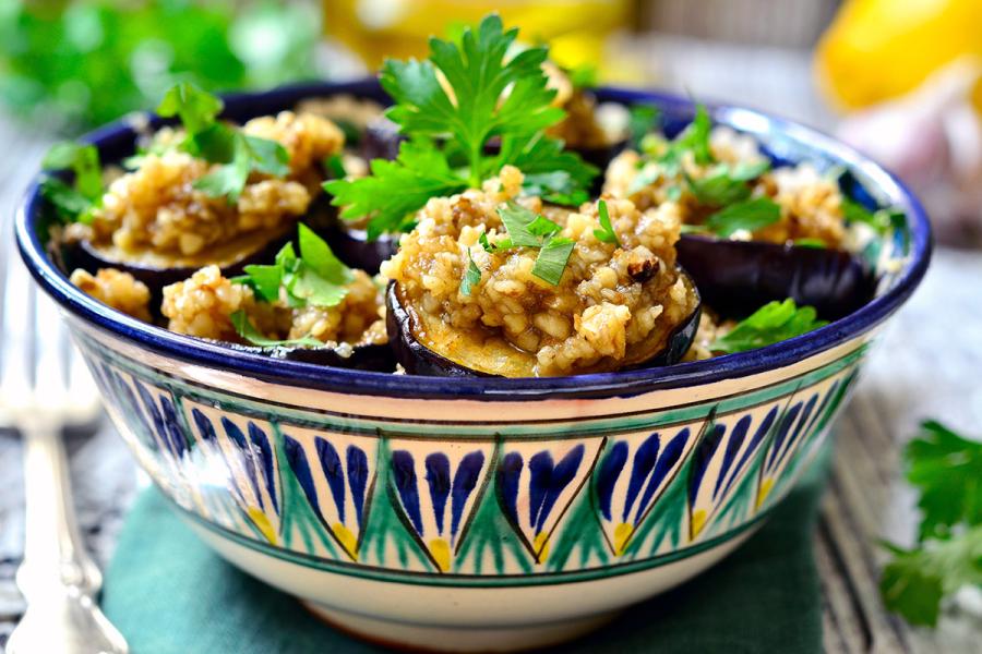 Fried eggplant slices topped with aillade sauce.